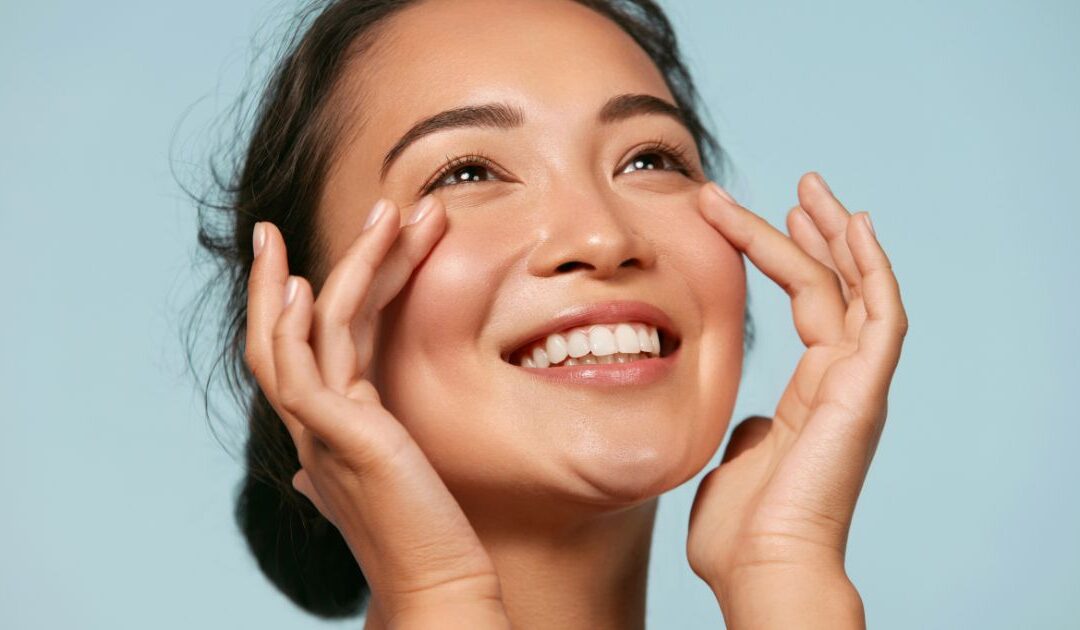 Young woman stretching outdoors, embracing wellness and natural beauty, representing the benefits of oxygen therapy for anti-aging and skin health.